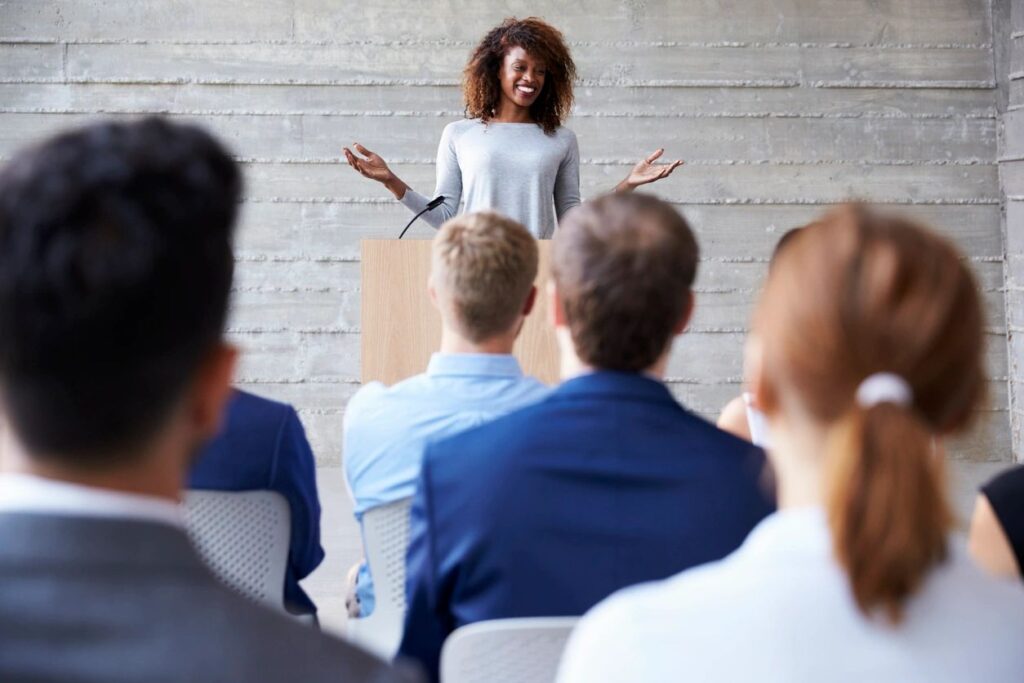 woman standing at front of presentation
